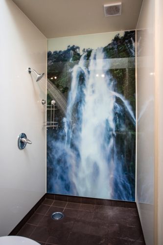 Bathroom with beautiful waterfall photo backdrop
