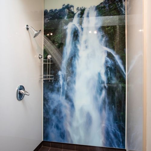 Bathroom with beautiful waterfall photo backdrop