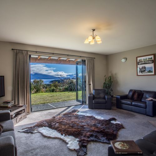 Loch Vista lounge with lake and mountain views