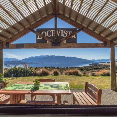 View From Kitchen of the outdoor area and surrounding mountains and Lake Te Anau